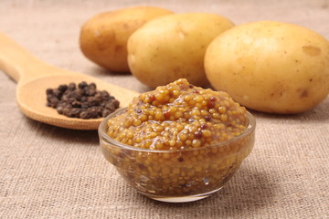 Traditional dijon mustard in a glass jar