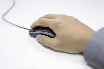 Closeup of Man hand clicking mouse

