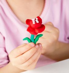 Child hands  with colorful clay