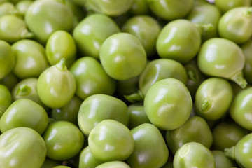 fresh green peas on white background