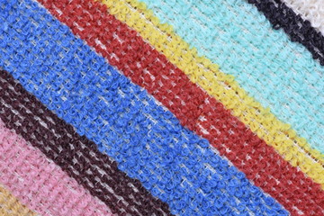 Multicolored fabric stripes for washing dishes as background