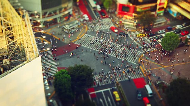 Thousands of people walk across the famous Shibuya Crossing in Tokyo Japan