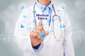 Doctor hand touching medical ethics sign on virtual screen. medical concept