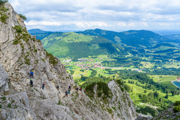 Hiker climbing in the mountain of Alps, Europe