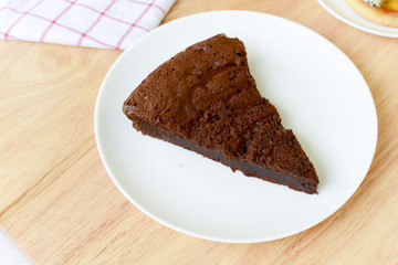 chocolate cake on wood table.