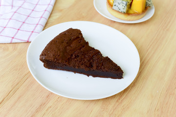 chocolate cake on wood table.
