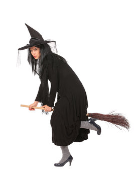 young black dressed witch flying on broom, isolated on white background