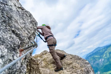 Gardinen Hiker climbing in the mountain of Alps, Europe © Simon Dannhauer