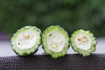 Bitter melon sliced sliced into three parts