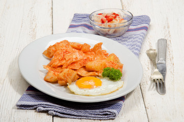 hungarian dish with paprika potatoes, noodles and fried egg