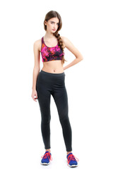 fitness woman in sport style standing against white background.