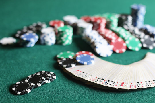 Poker chips and cards on the cloth