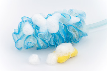 Fototapeta na wymiar soft blue bath puff and soap