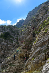 Hiker climbing in the mountain of Alps, Europe