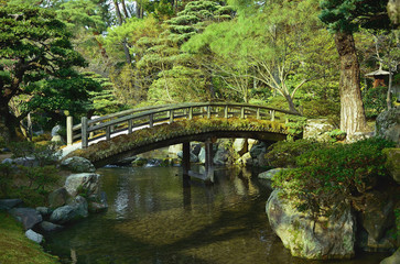 Old wooden bridge at Japanese garden, Kyoto Japan.