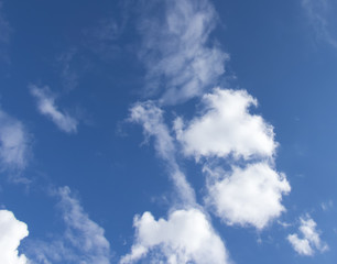 White clouds in a dark blue sky in Europe