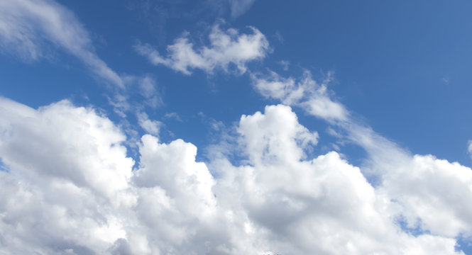 White clouds in a dark blue sky in Europe