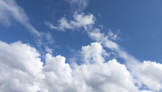 White clouds in a dark blue sky in Europe