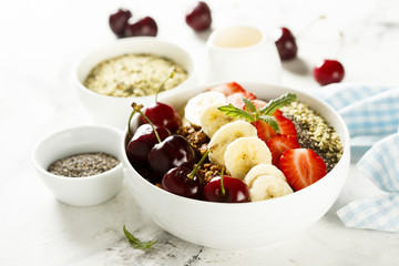 Breakfast bowl with fruits, seeds and berries