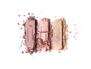 Broken neutral eye shadow make up trio isolated on a white background