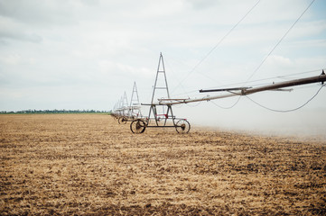 Mobile irrigation pivot watering a field