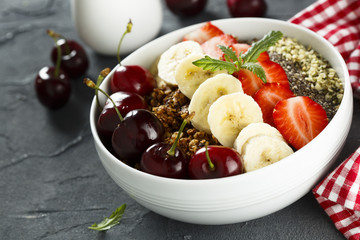 Breakfast bowl with fruits, seeds and berries