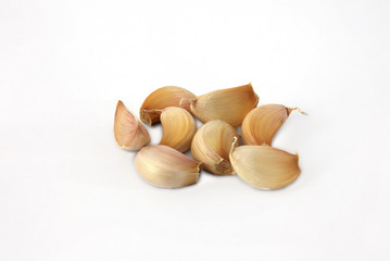 peeled garlic clove isolated on a white background