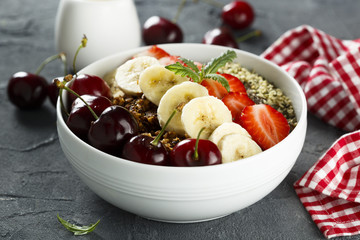 Breakfast bowl with fruits, seeds and berries