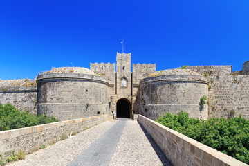 Fototapeta na wymiar bridge and gate between two towers of castle Rhodes view from below