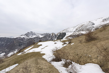 Monte Altissimo's steep hill  with some snow, Trentino, Italy