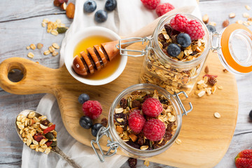 Homemade granola with fresh berries for breakfast, top view