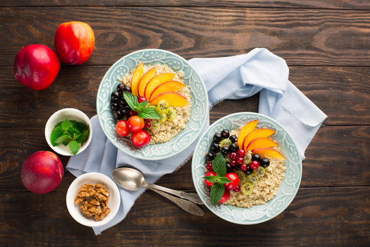 Quinoa porridge with fresh fruits for breakfast, top view