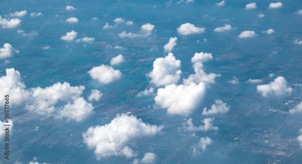 Wall mural aerial view of cloud and sky from airplane window looking down t