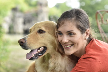 Portrait of woman with dog at the park