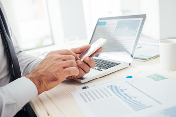 Businessman using a financial app