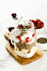 Layered granola with fruits and berries for breakfast