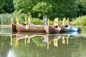 Obraz premium Mock viking row boats on lake