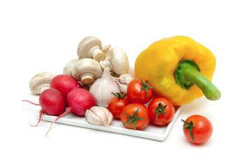 vegetables and mushrooms champignons close up on a white backgro