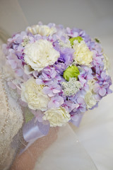 Bride holding flower bouquet