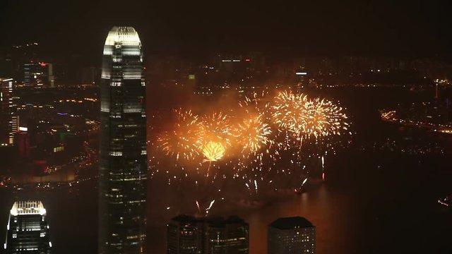 Hong Kong fireworks. Hong Kong Island in the foreground and Kowloon across the Harbor.