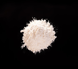 Drug powder close-up on a black background.