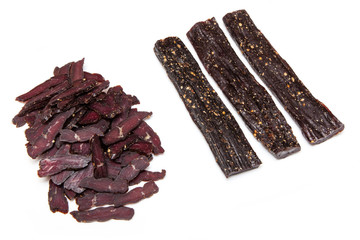 South African beef biltong , dried beef jerky isolated on a white studio background.