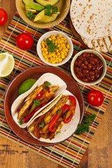 Fajita Chicken Tacos with Grilled Onions and Bell Peppers. Selective focus.