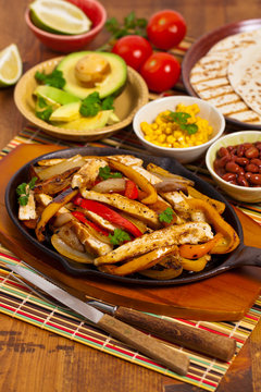 Chicken Fajitas with Grilled Onions and Bell Peppers. Selective focus.