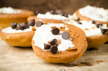 Homemade cookies with whipping cream and chocolate chip on top