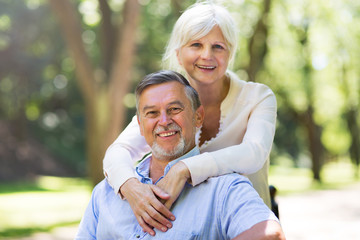 Senior couple embracing outdoors 
