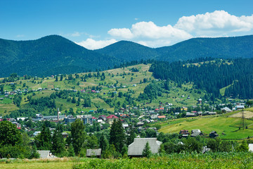 Fototapeta na wymiar Panorama of settlement and Carpathian mountains in Ukraine