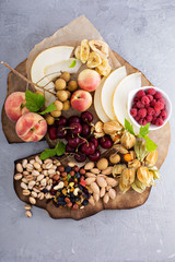 Fototapeta na wymiar Fruit and nuts snack board