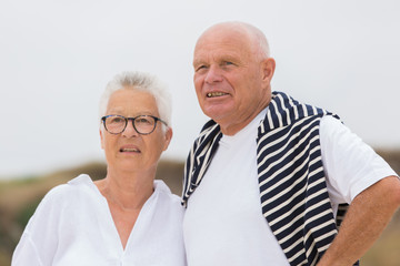 senior couple looking the sea