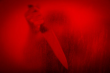 Horror scene of woman with knife behind stained or dirty window glass,Serial killer or violence concept background - 116788865